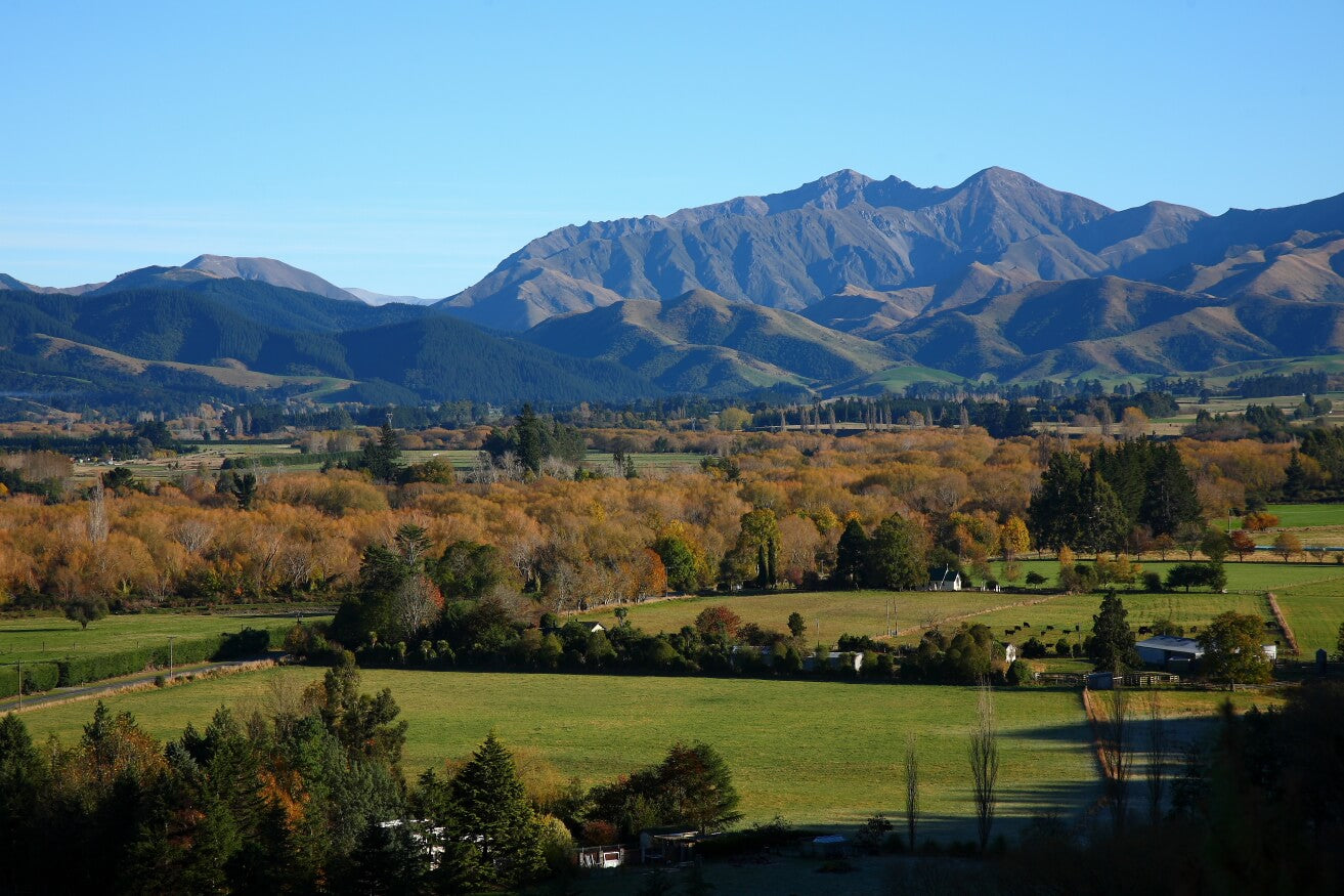 Scenic view of a mountain range behind Geraldine with pleasant valley in the foreground